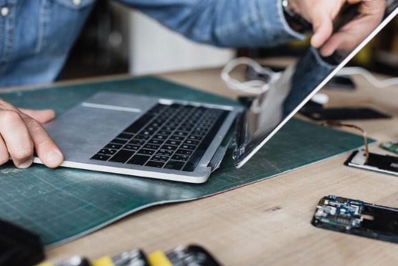 Laptop with broken joint, screen falling off